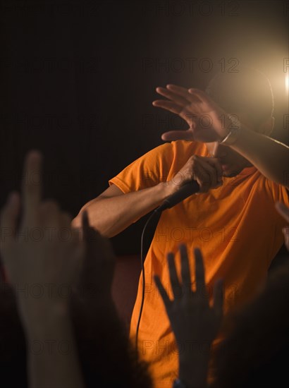 African man singing to audience