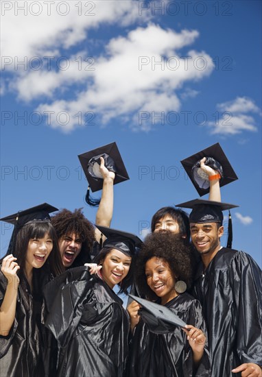 Multi-ethnic friends celebrating graduation