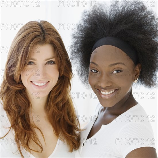 Smiling Caucasian and African woman