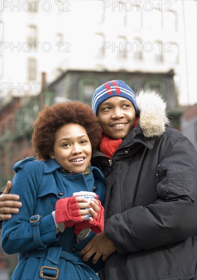 African man hugging girlfriend