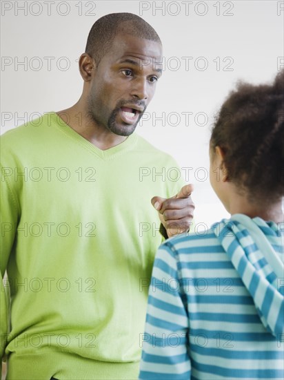 African father scolding daughter