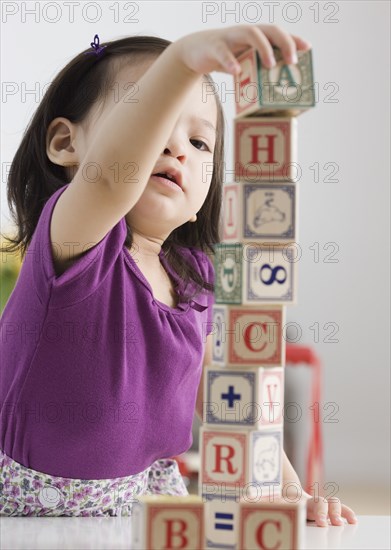 Toddler girl playing with blocks