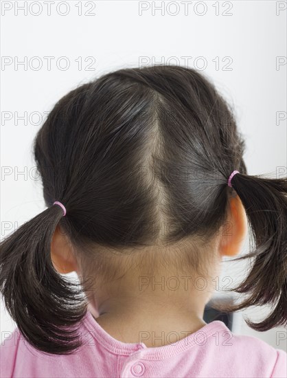 Rear view of girl with pigtails