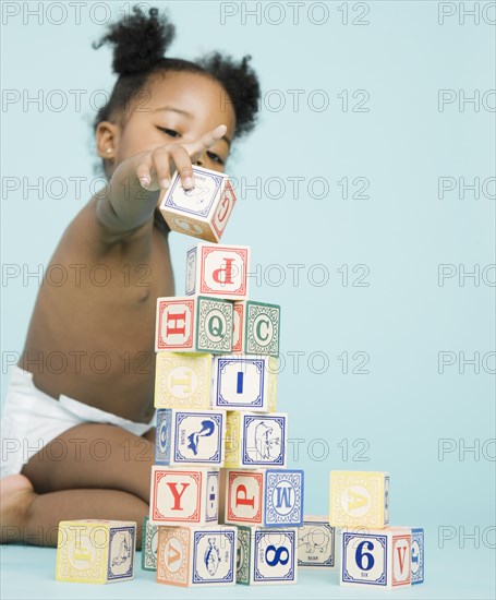 African American girl stacking wooden blocks