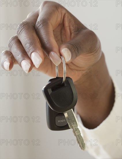 African woman holding car keys