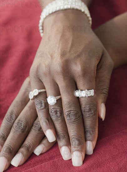 African woman wearing many diamond rings