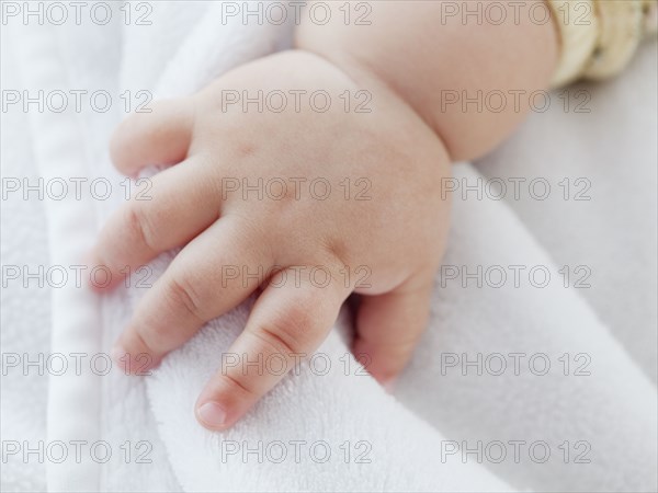 Close up of mixed race baby girl's hand