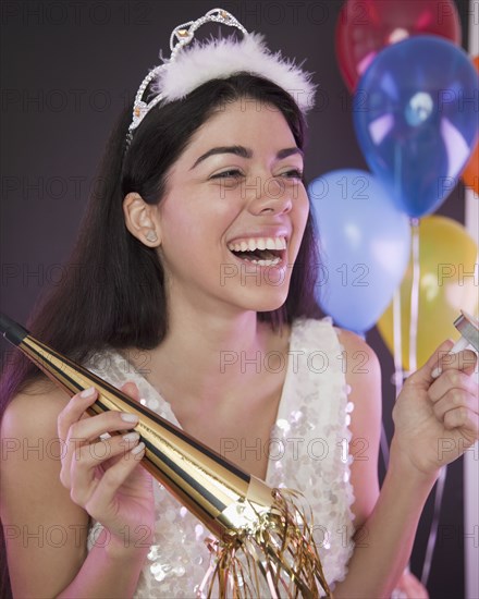 Hispanic woman at New Year's Eve party