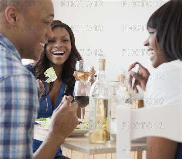 African friends enjoying dinner party