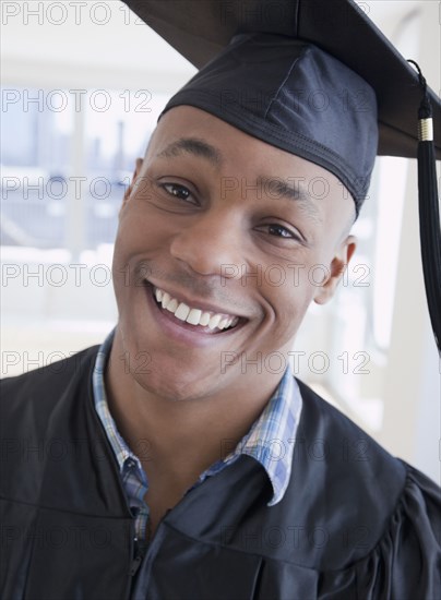 African man in graduation cap and gown