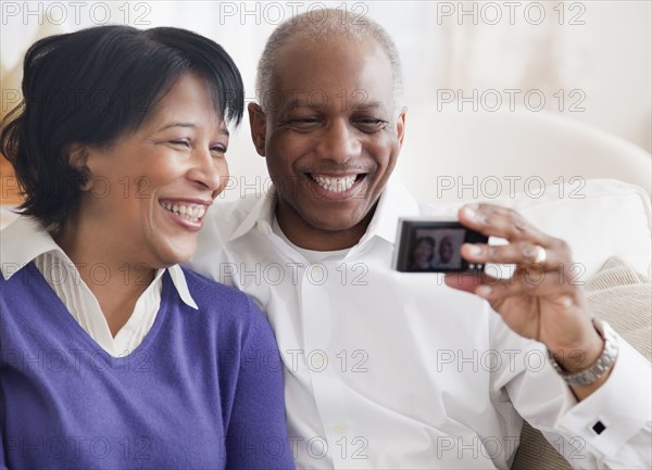African couple taking self-portrait