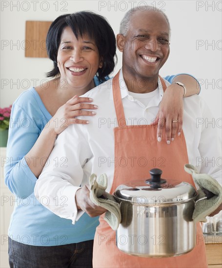 African couple preparing dinner