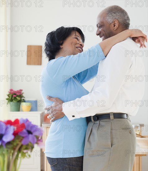 African couple hugging