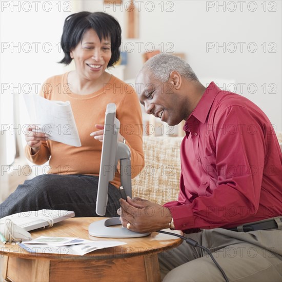 African couple assembling computer