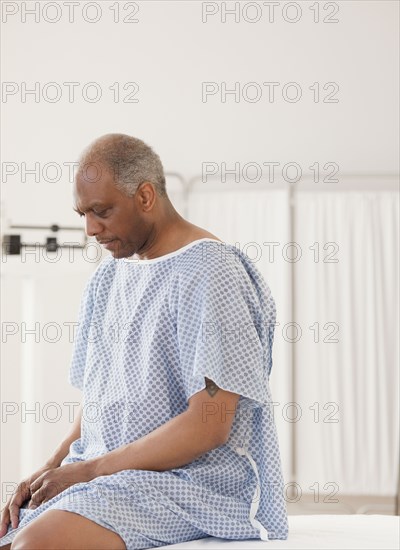 African man waiting for doctor in hospital