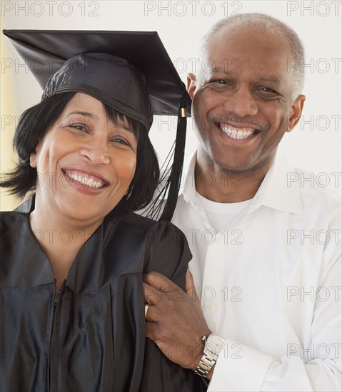 African woman graduate with husband