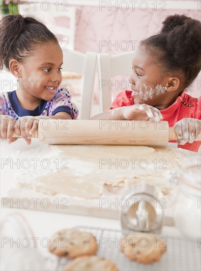 African girls making cookies