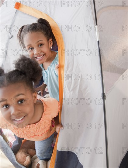 African girls playing in tent