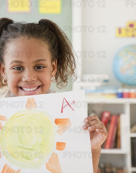 African girl with A plus on painting