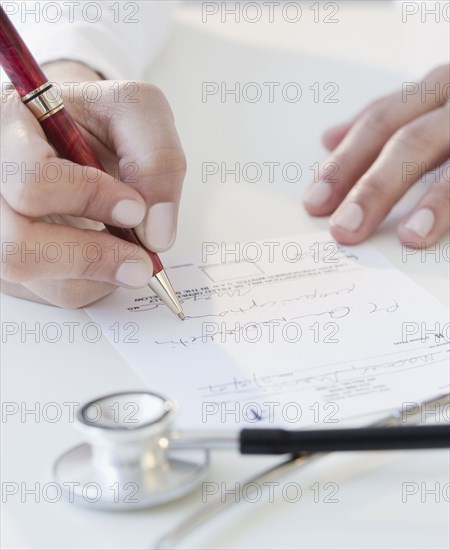 Doctor writing prescription