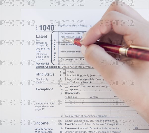 Woman completing tax form