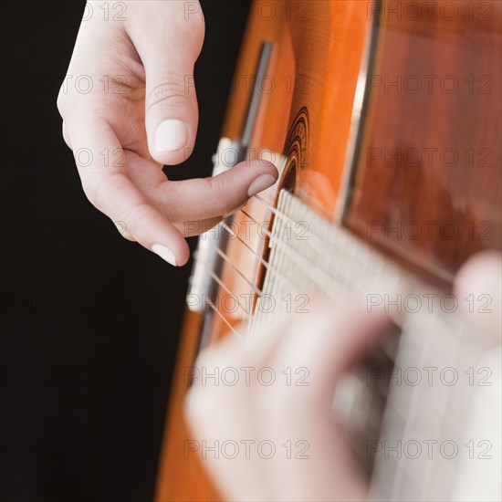 Woman playing guitar