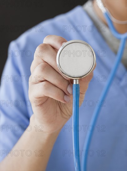 Doctor holding stethoscope