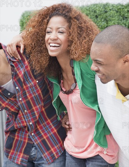 Friends hugging and laughing