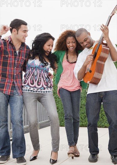 Friends playing guitar