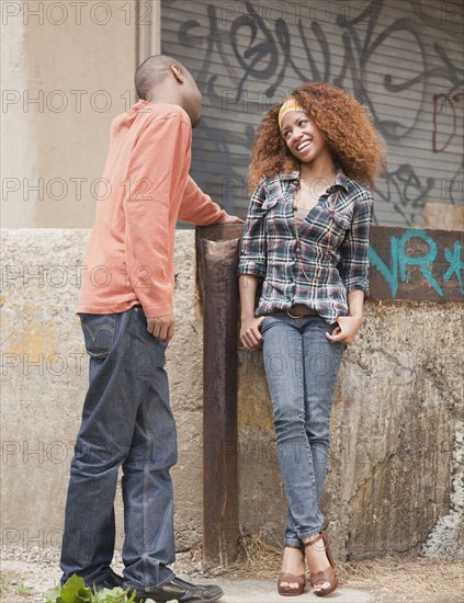 Man and woman flirting on urban street