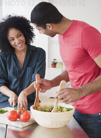 Couple preparing salad