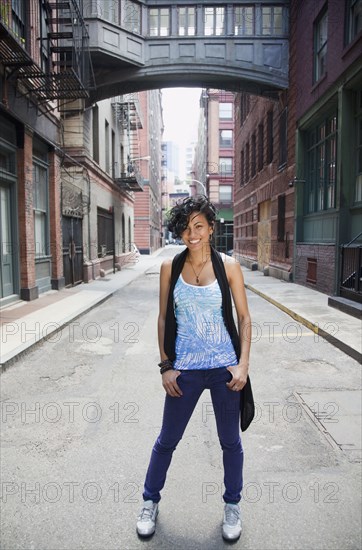 Mixed race woman standing on urban street