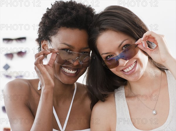 Friends shopping for sunglasses