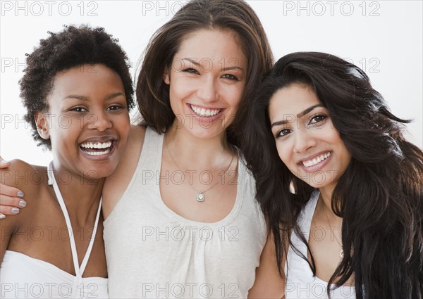 Smiling friends hugging