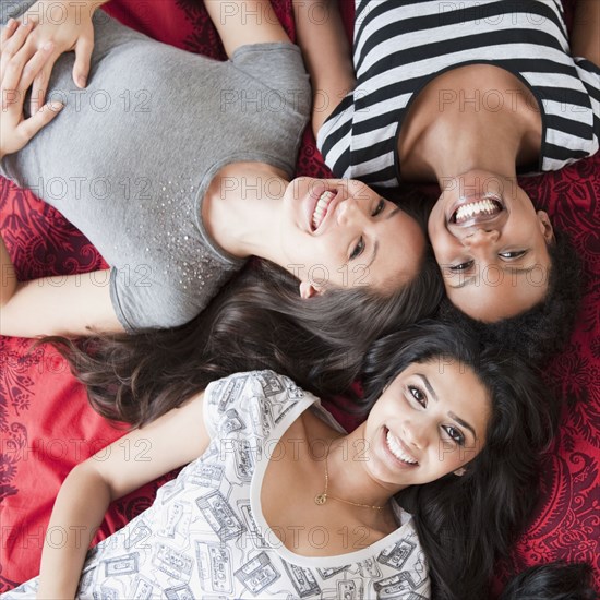 Friends relaxing on floor together