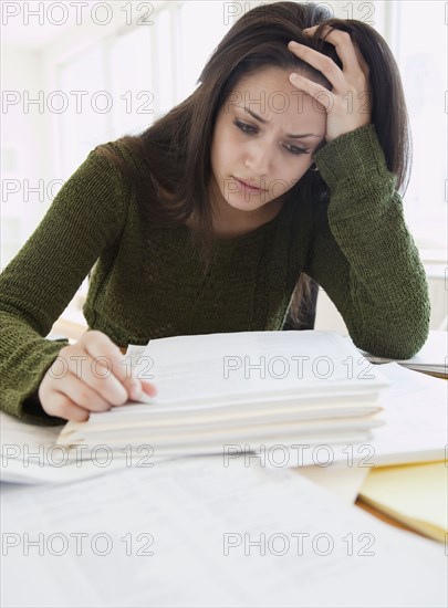 Mixed race woman frustrated over paperwork