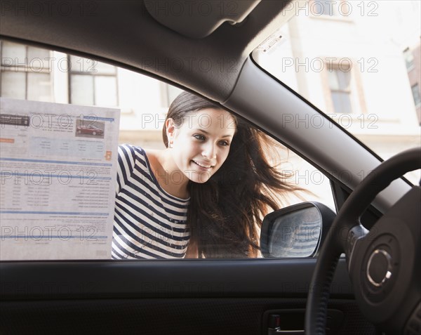 Mixed race woman shopping for new car