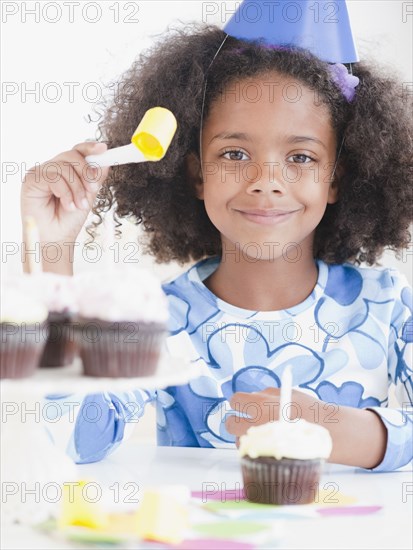 Mixed race girl at birthday party