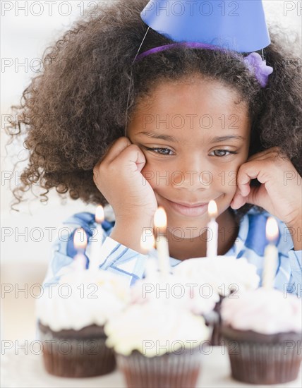 Mixed race girl at birthday party