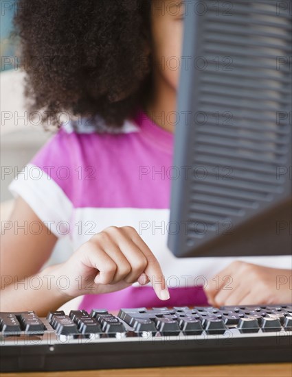 Hispanic girl using computer