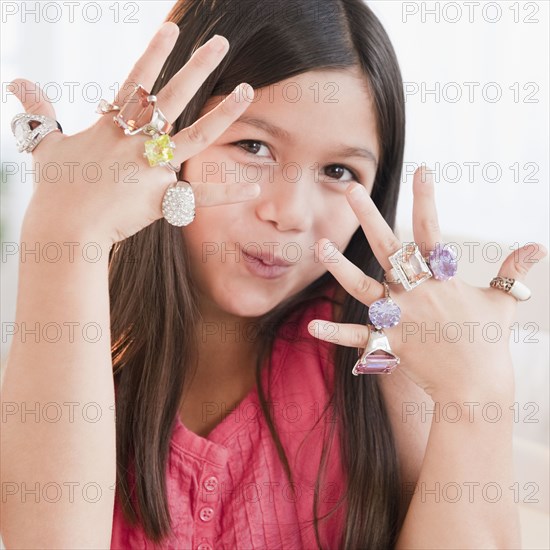 Mixed race girl wearing glamorous rings