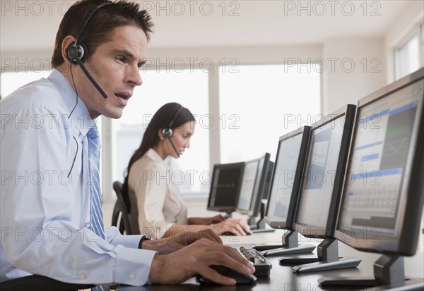 Hispanic businessman working on computer