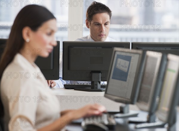 Hispanic businessman working on computer