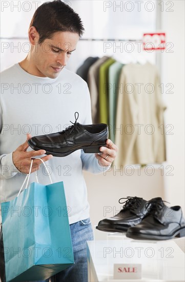 Hispanic man shoe shopping