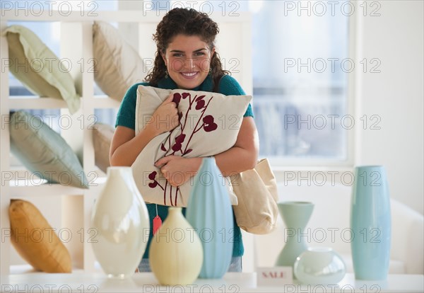 Mixed race woman shopping for pillows