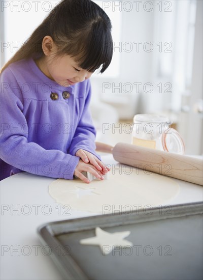 Chinese girl making star-shaped cookies