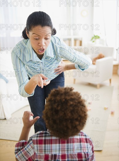 Mixed race mother lecturing son