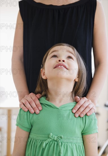 Mixed race girl looking at mother