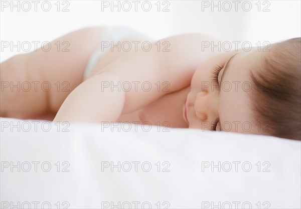 Mixed race baby boy sleeping
