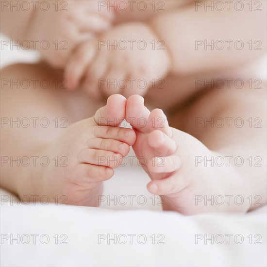 Mixed race baby boy's toes